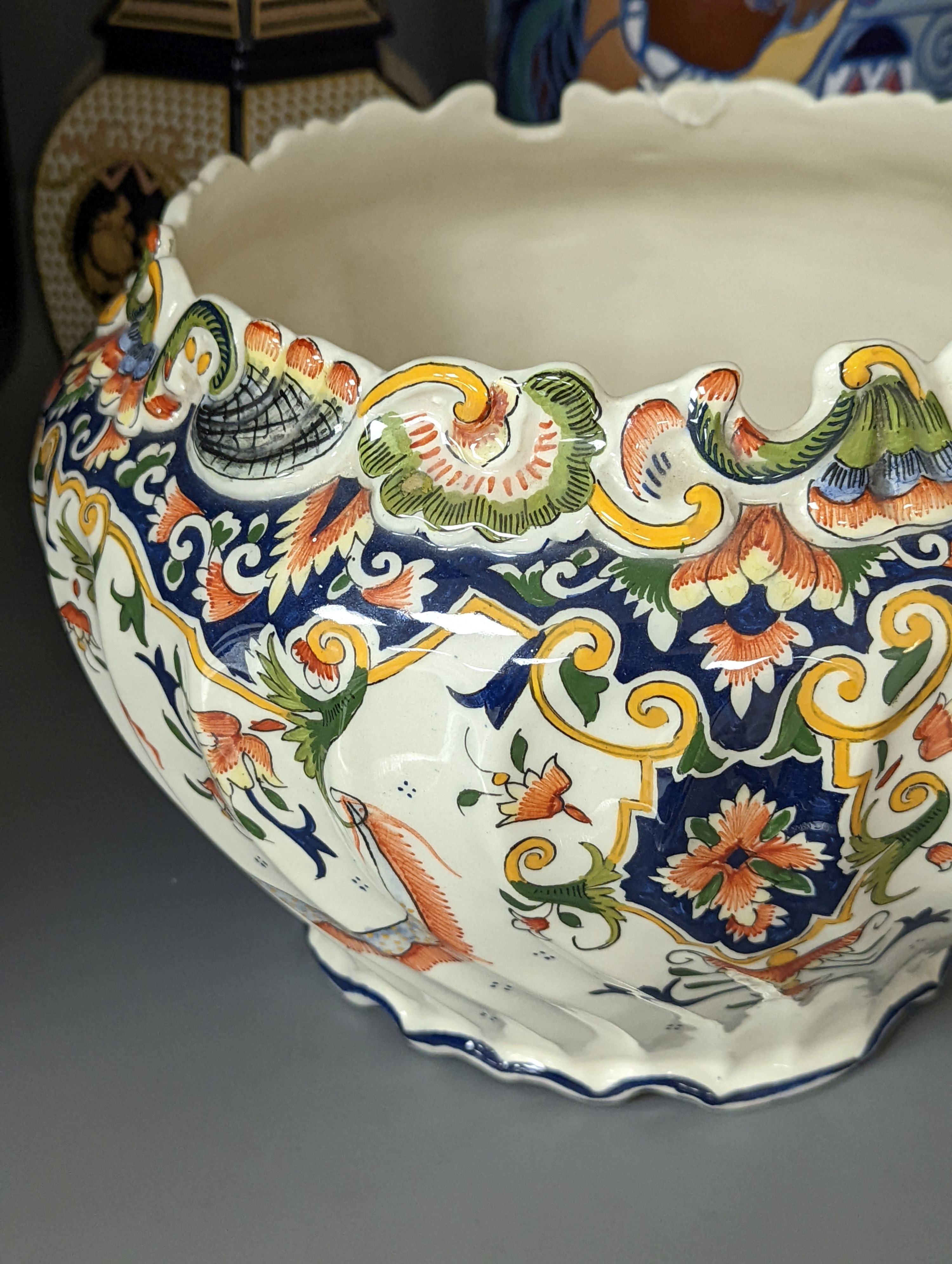 A Mont Saint Michael jardiniere, a lidded jar, two vases and an Amphora chicken decorated vase, Amphora vase 36 cms high.